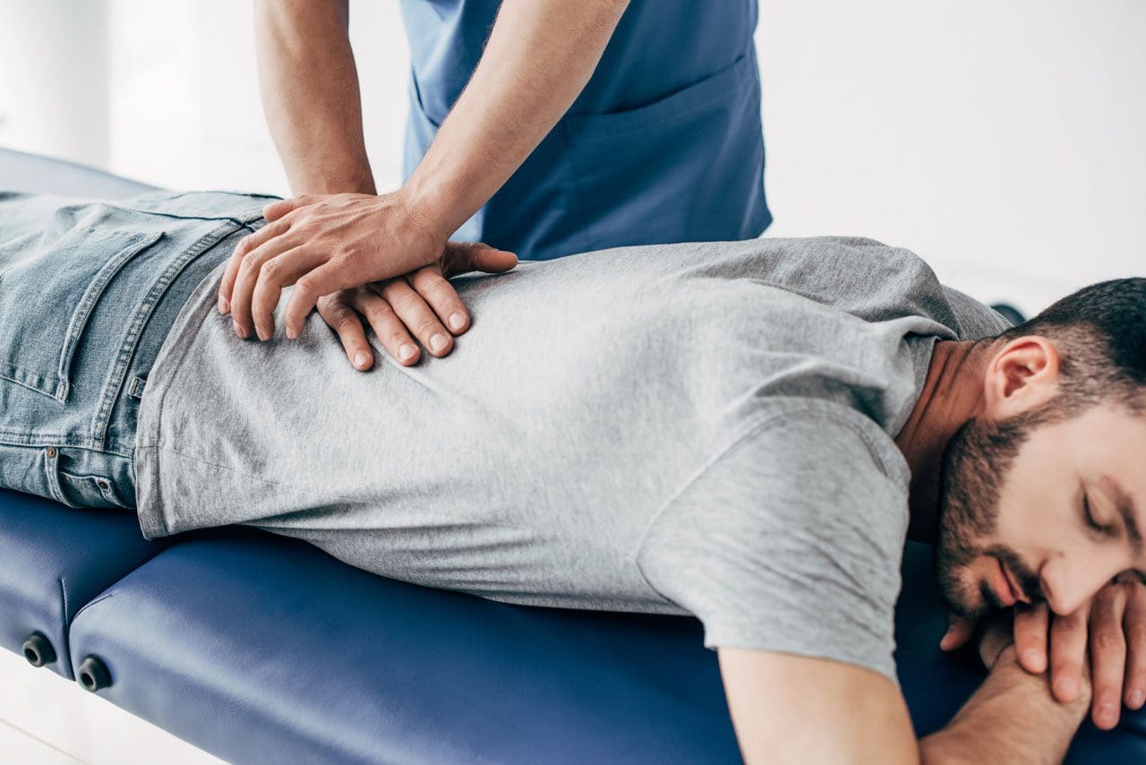 https://healthcoach.clinic/wp-content/uploads/2021/06/chiropractor-massaging-back-of-man-on-massage-tabl-2ET7R4P_02.jpg